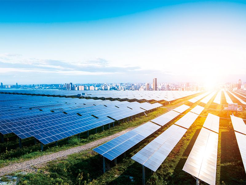 Solar panels with city skyline